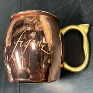 Copper mug that says “Fidenza” on it. A town in Italy.